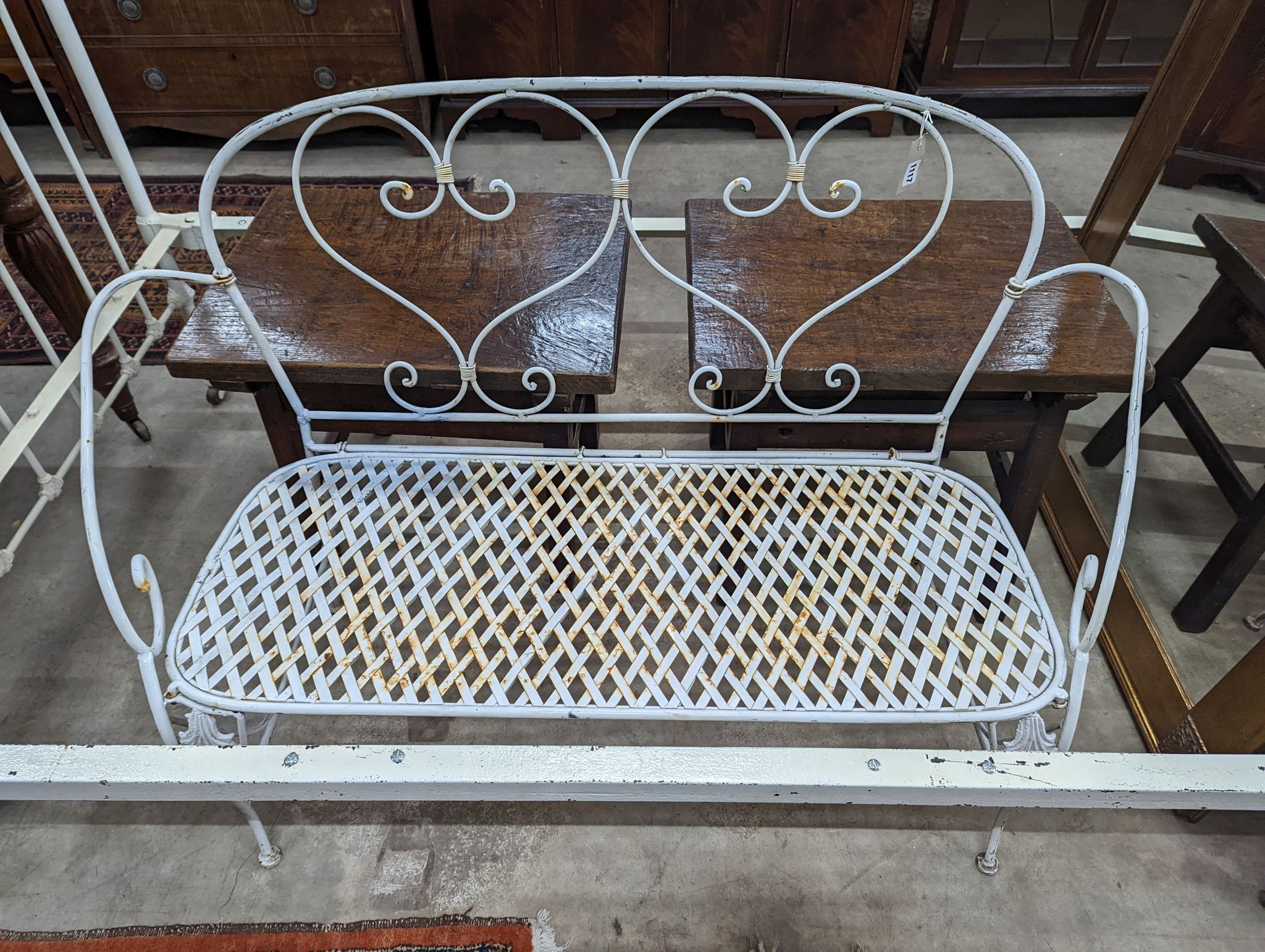 A French wrought iron garden bench, length 135cm, depth 50cm, height 96cm